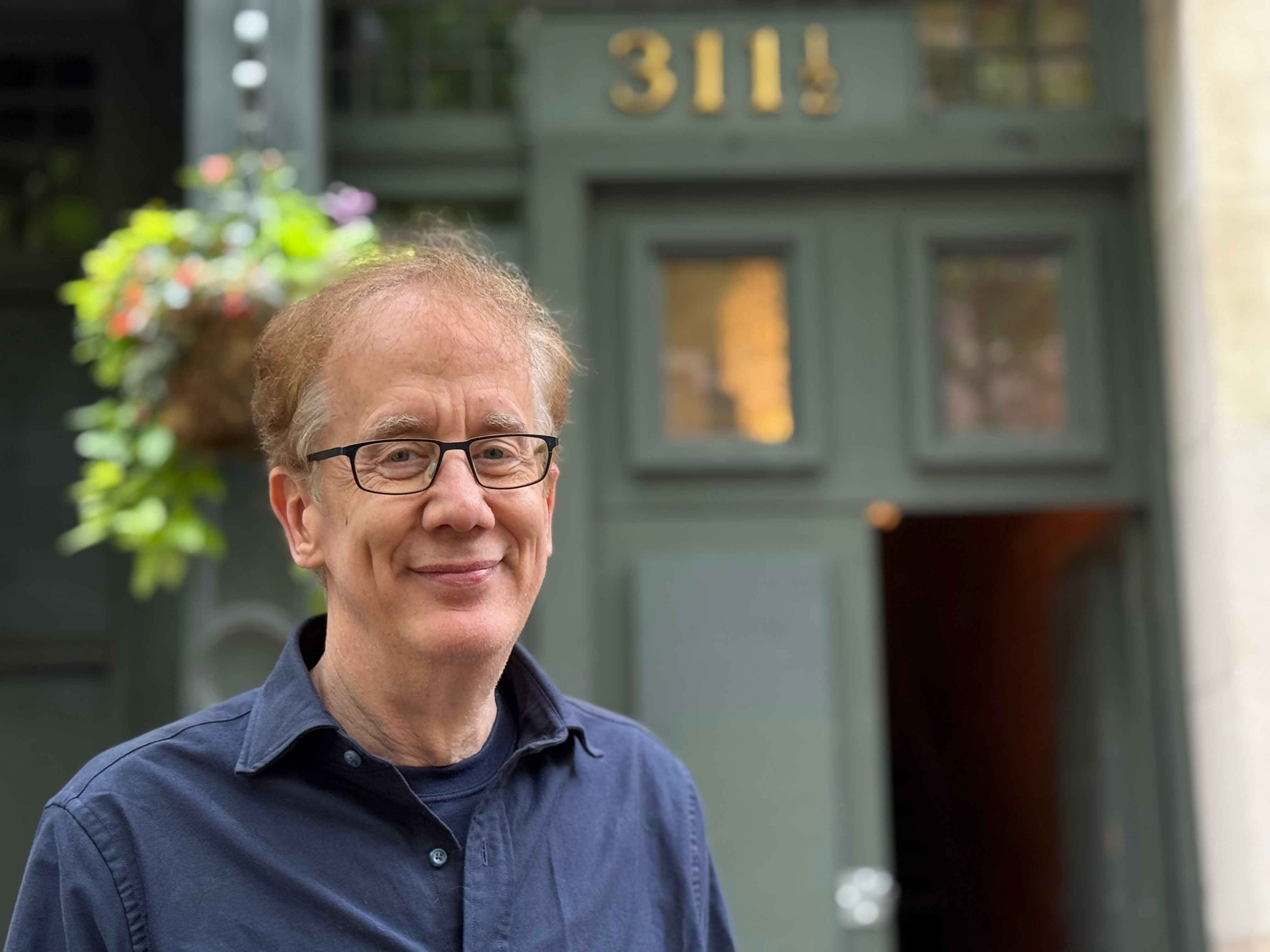 Andrew Conru outside the Occidental building in Pioneer Square